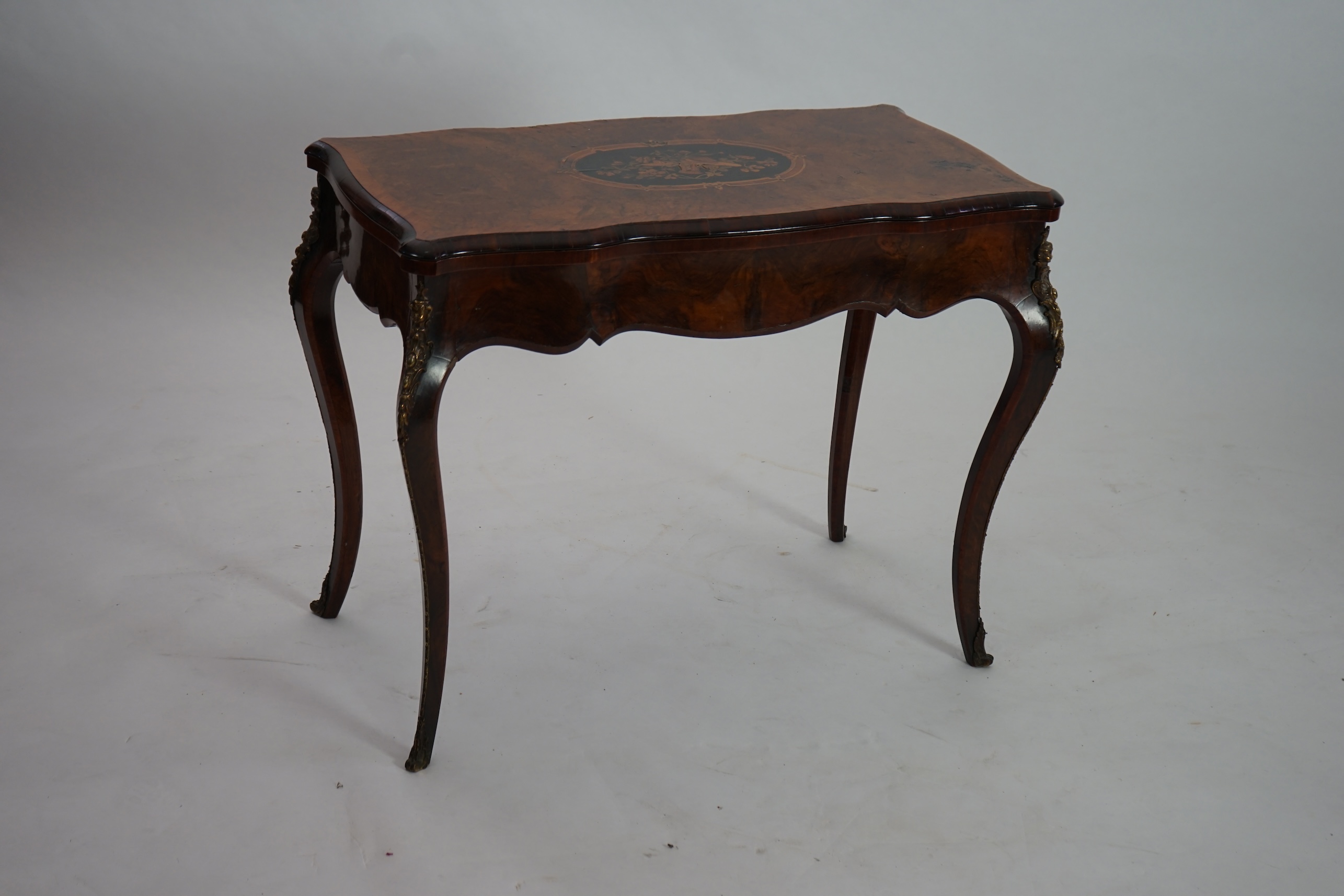 A Victorian marquetry inlaid burr walnut card table